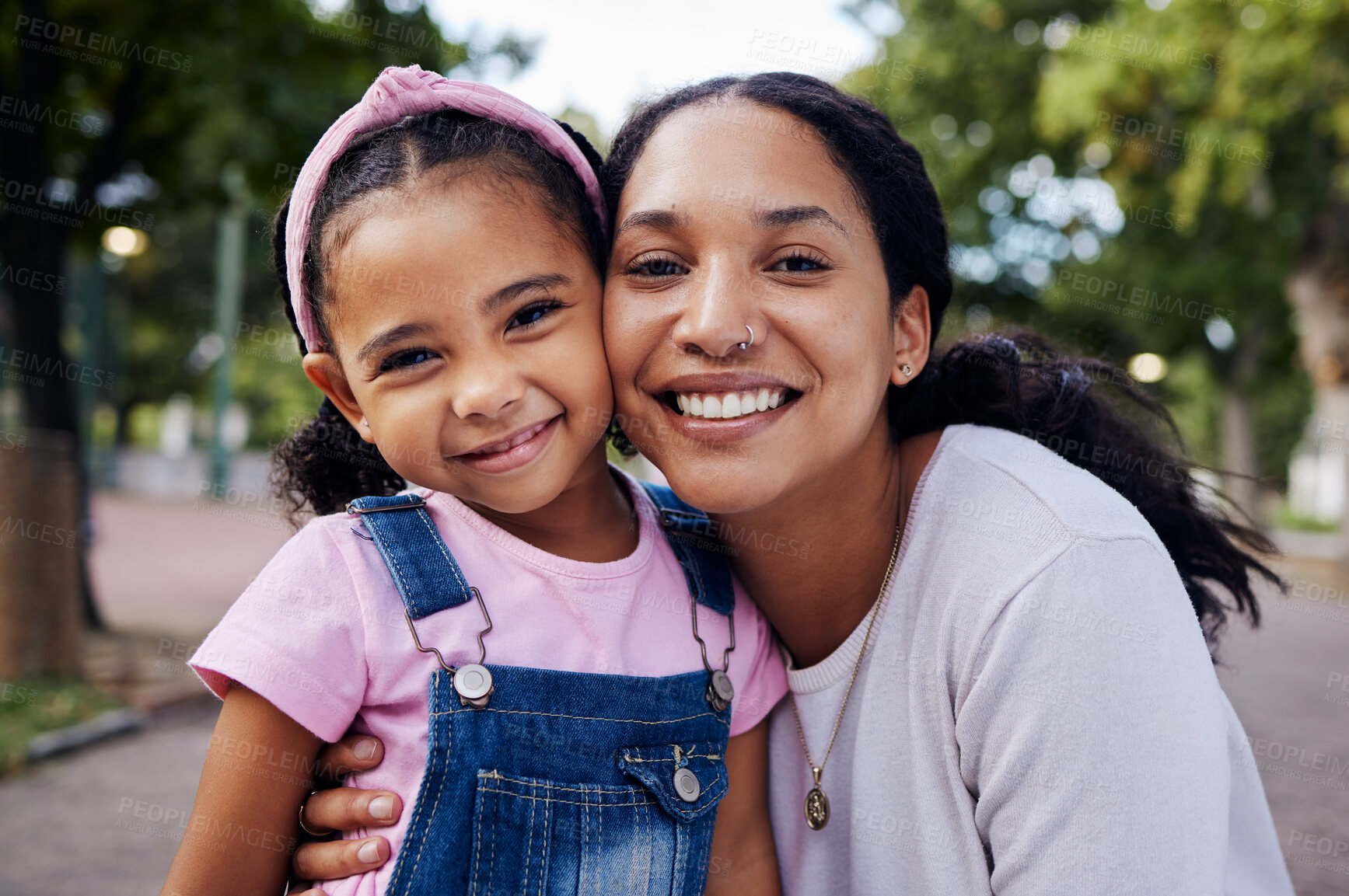 Buy stock photo Family, face and mom with kid in park, portrait with hug and fun day outdoor, love and care in nature with happy people. Smile, happiness and adventure with woman and girl bonding with childhood