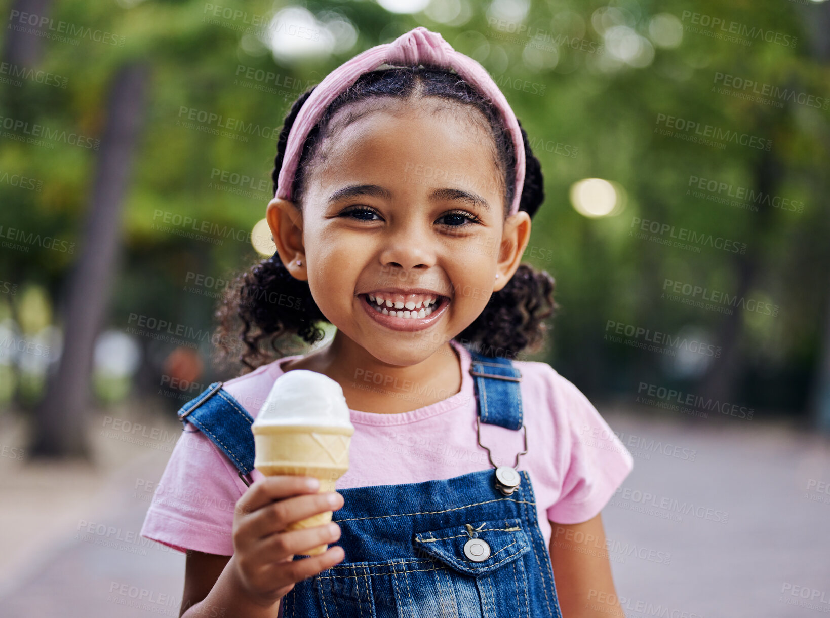 Buy stock photo Portrait, young girl with ice cream in park, happy child outdoor with nature and freedom, dessert and smile. Travel, happiness and adventure, growth and childhood with family day out and youth mockup