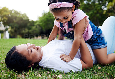 Buy stock photo Mother, daughter and playing on grass, relax and laughing while bonding and having fun at a park. Mama, girl and game on a forest floor, joy and smile while enjoying a happy moment on the weekend