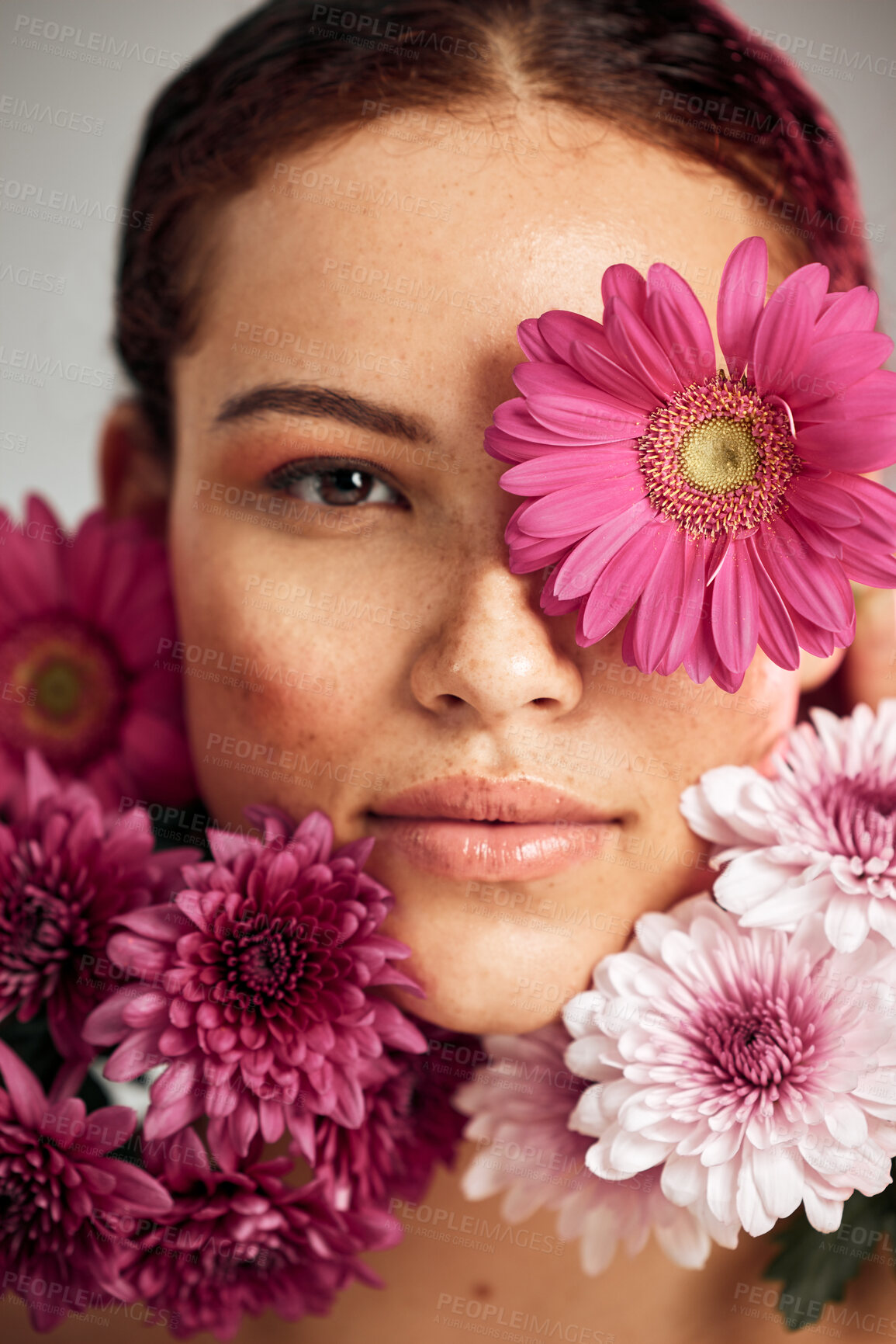 Buy stock photo Flowers, woman and studio portrait for beauty, wellness and skincare with spring aesthetic by background. Model, girl and carnation plants for cosmetic health, healthy face glow or sustainable petals