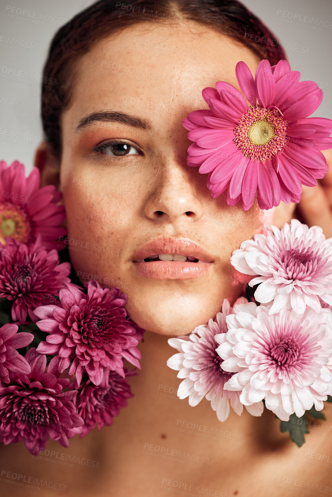 Buy stock photo Woman, flowers and studio portrait for beauty, wellness and skincare with spring aesthetic by background. Model, girl and carnation plant with cosmetic health, natural skin glow and symbol for growth