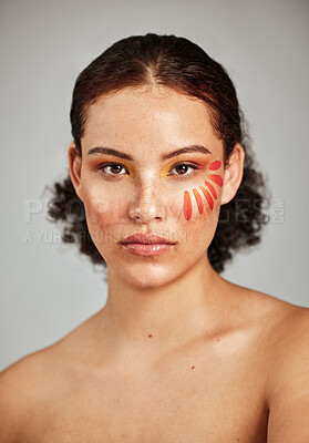 Buy stock photo Flower petal, beauty and makeup portrait of a woman in studio for natural face and skincare. Facial cosmetic, wellness and self care for skin glow, floral sustainability and dermatology of person