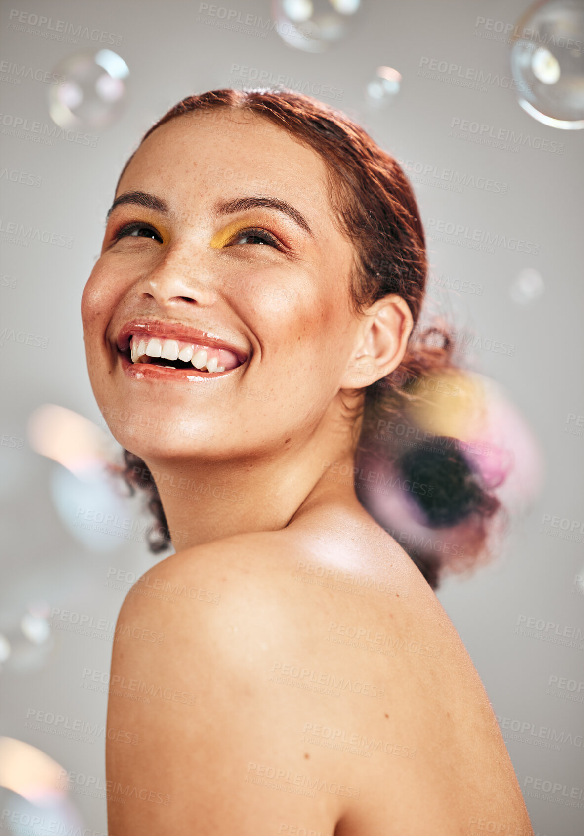 Buy stock photo Happy face, bubbles and woman in studio for skincare cosmetics, natural skin glow and dermatology. Facial makeup, health and wellness of aesthetic model person with luxury body product and hope
