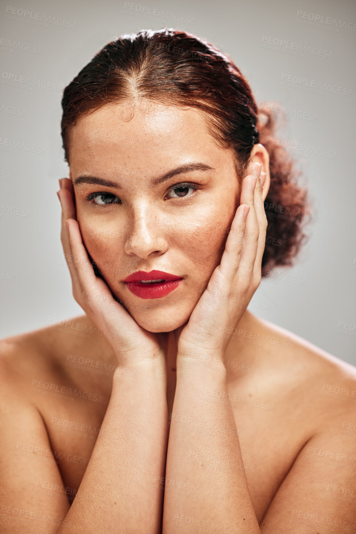 Buy stock photo Makeup, beauty woman and portrait with face in hands in studio for cosmetics and skin dermatology. Headshot of aesthetic person with red lipstick color for strong and confident facial skincare idea