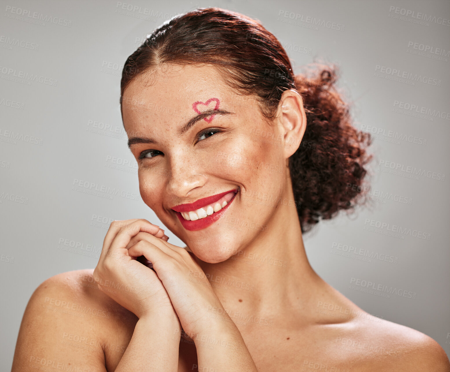 Buy stock photo Makeup heart, beauty portrait and happy woman model in studio for cosmetics and dermatology. Headshot of aesthetic person with red color lipstick for love and valentines day facial skincare idea