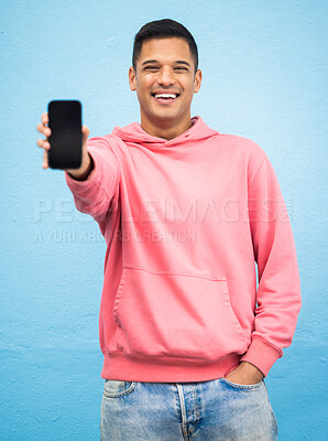 Buy stock photo Happy man, portrait or phone screen mockup on isolated blue background for social media, app or web design. Smile, student or model with technology mock up for city contact communication or branding