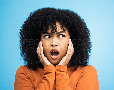 Buy stock photo Wow, surprise and thinking with a black woman in shock standing on a blue background in studio. Omg, confused and idea with an attractive young female looking shocked or surprised indoor