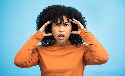 Buy stock photo Wow, surprise and portrait with a black woman in shock standing on a blue background in studio. Omg, confused and face with an attractive young female looking shocked or surprised indoor