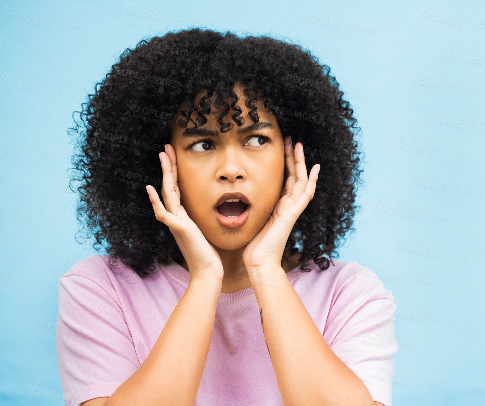 Buy stock photo Shock, surprise face and black woman with isolated blue background in a studio. Wow, thinking and hands of a young person hearing a secret or surprising announcement feeling confused and annoyed