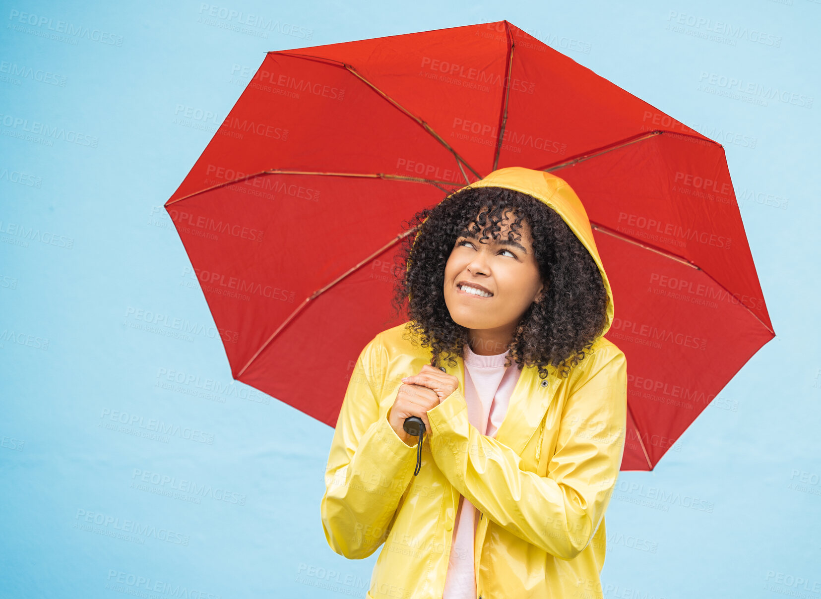 Buy stock photo Young african woman, umbrella and wall with smile, rain and fashion raincoat for safety, wellness or protection. Thinking gen z girl, winter or check sky for weather, walk or urban outdoor adventure