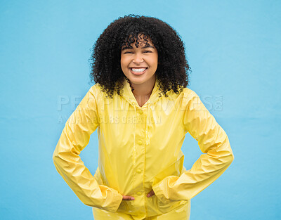 Buy stock photo Black woman, smile and happiness in portrait with rain coat,
fashion for winter and beauty isolated on blue background. Happy in studio, style and jacket with mockup, trendy and excited female