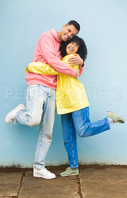 Buy stock photo Love, wall and couple hug, smile and reunion for relationship, celebration and loving together. Romantic, happy man and woman embrace, achievement and playful on date, cute and bonding for romance