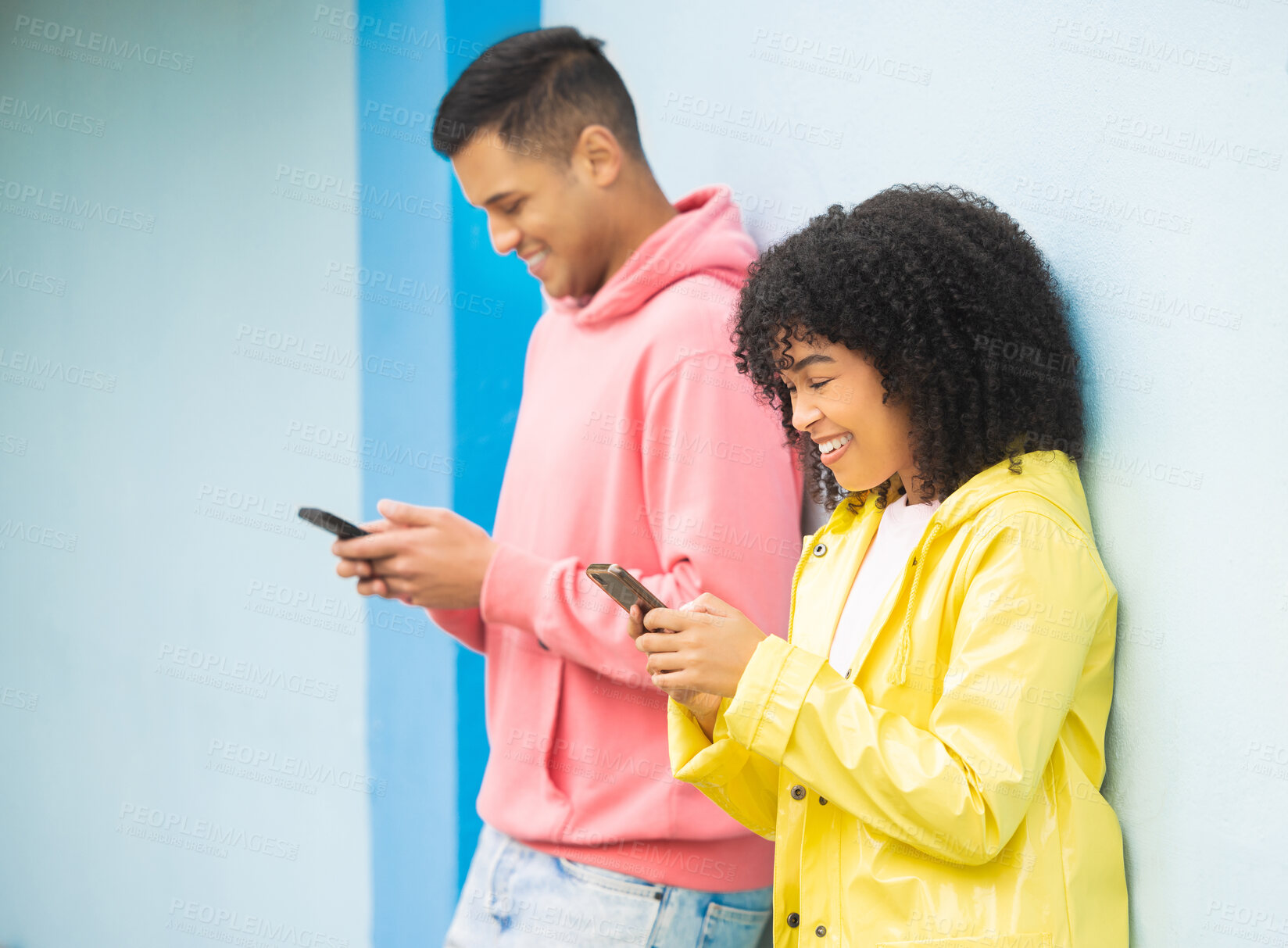 Buy stock photo Happy people, bonding or phone typing on isolated blue background on social media, couple dating app or city networking. Smile, man or afro woman on mobile technology or community communication web