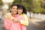 Black couple, smile and hug portrait of young people with love, care and bonding outdoor. Happy woman, man and summer fun of people on a street walking with happiness on vacation smiling together