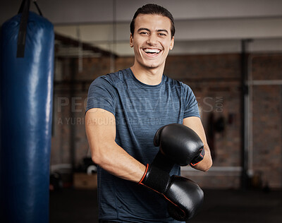 Buy stock photo Fitness, portrait and man with boxing gloves in gym for training, exercise or training. Happy, smile and male athlete or boxer doing cardio kickboxing workout for health or wellness in sports studio.