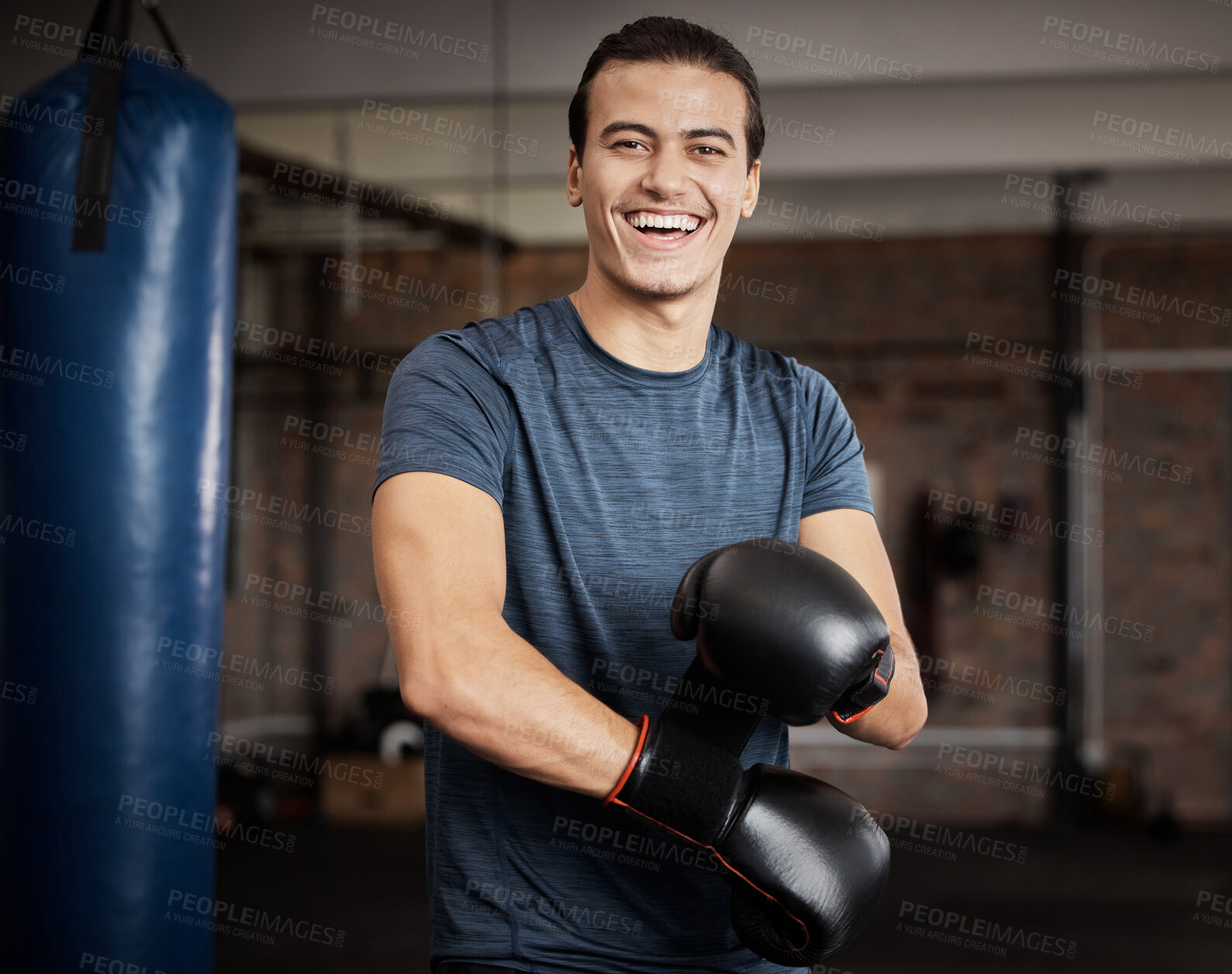 Buy stock photo Fitness, portrait and man with boxing gloves in gym for training, exercise or training. Happy, smile and male athlete or boxer doing cardio kickboxing workout for health or wellness in sports studio.