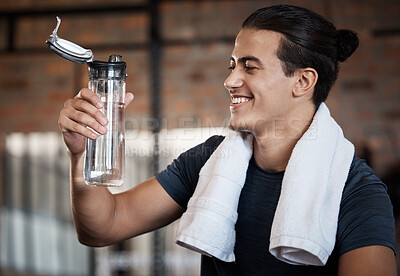 Buy stock photo Fitness, smile and drinking water with man in gym for health, exercise and cardio endurance. Wellness, weightlifting or training with body builder on break in sports center for stamina, detox or diet
