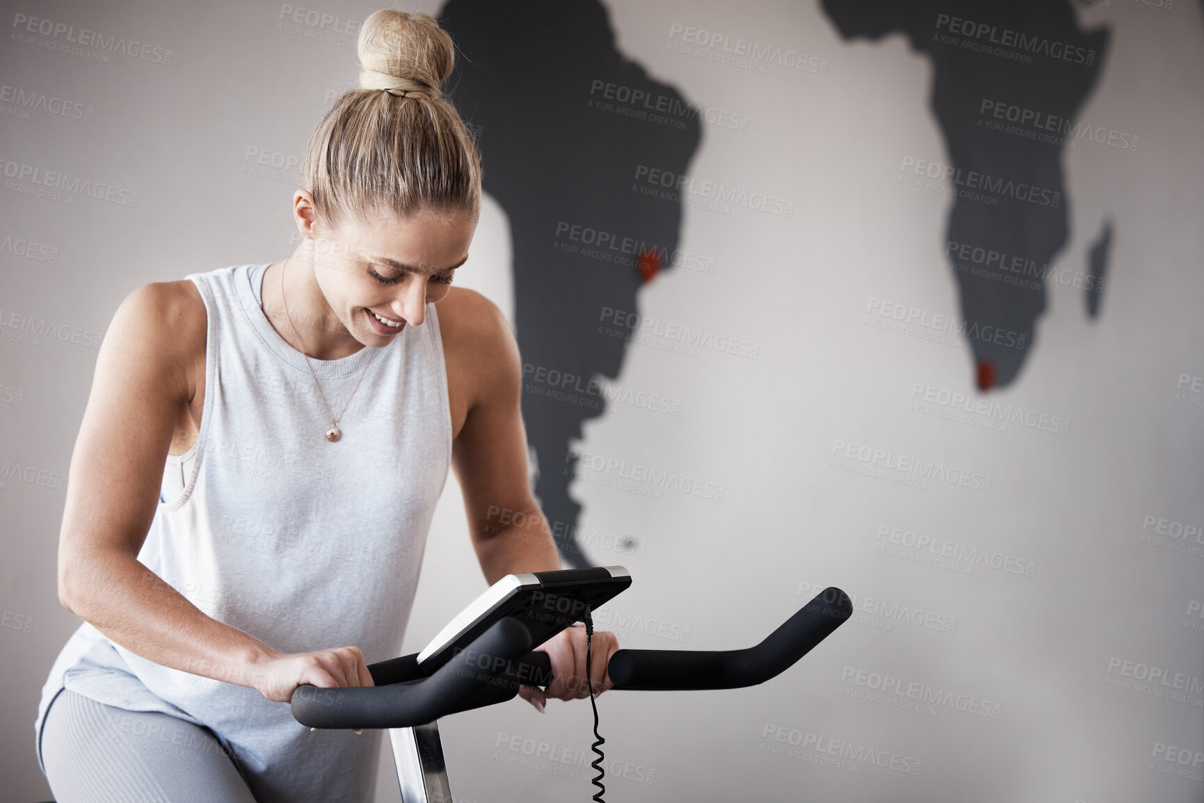 Buy stock photo Fitness, gym bike and woman cycling for cardio performance, body wellness and exercise mockup. Health goals, spin bicycle mock up or athlete girl happy for workout, sports training or power challenge