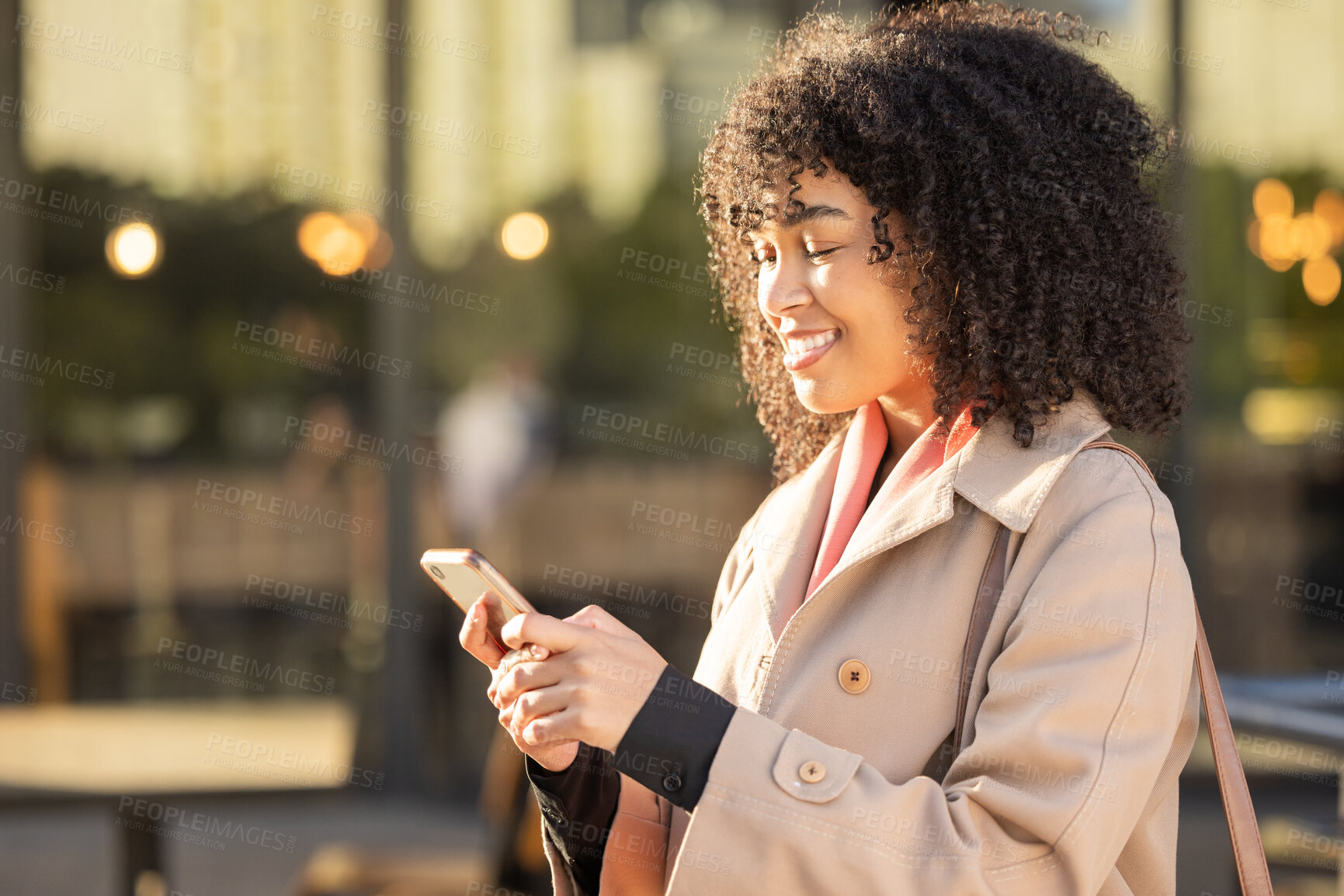 Buy stock photo Communication, travel or black woman with phone for networking, social media or search in London street. Happy, smile or professional on smartphone for research, internet or blog content outdoor