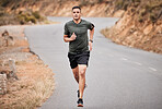 Fitness, running and man in road for exercise, training and workout with body lose weight, muscle and energy. Focus runner, athlete or healthy person jogging for sports challenge in nature street