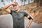 Tired, fitness and running man portrait of a marathon runner on a road feeling fatigue from workout. Exercise, athlete and sports person breathing from a health, wellness and cardio training 