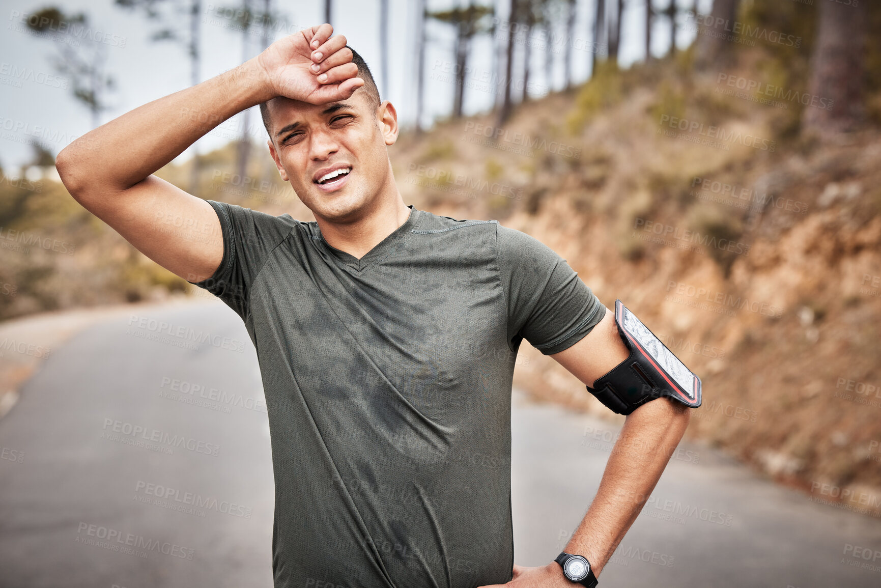 Buy stock photo Tired, fitness and running man portrait of a marathon runner on a road feeling fatigue from workout. Exercise, athlete and sports person breathing from a health, wellness and cardio training 