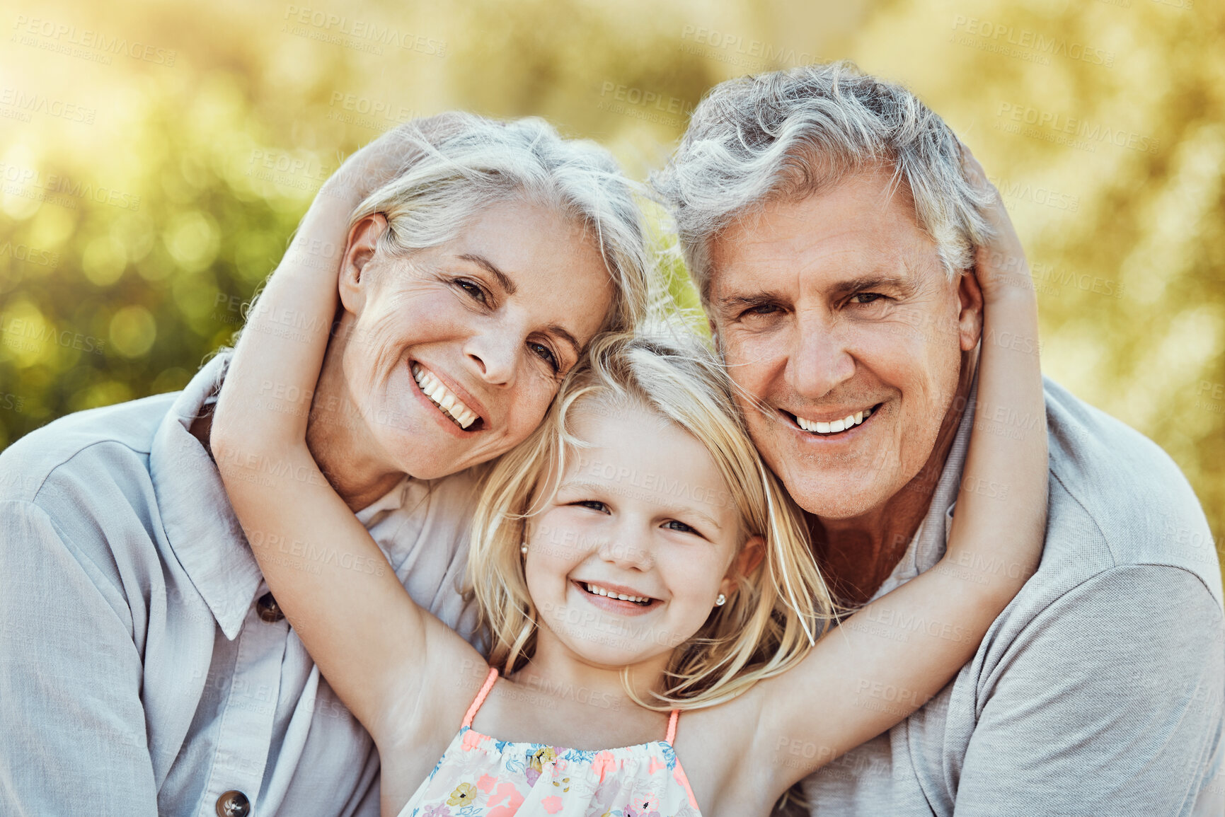 Buy stock photo Grandparents, park and child hug portrait with a young girl and elderly people with love and smile. Care, bonding together and nature of a family feeling happy with kid and elderly grandparent