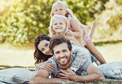 Buy stock photo Family, park and portrait of parents, children and happy people on garden grass in sunshine. Kids, mom and dad smile with love in nature, picnic and summer vacation to relax on lawn with happiness 