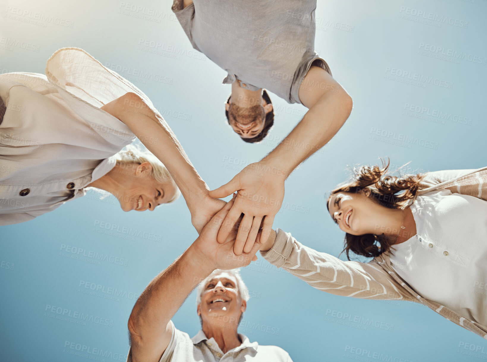 Buy stock photo Low angle, support or hands pile of happy family bonding in blue sky park, house garden or home nature backyard. Solidarity, community or teamwork collaboration stack for senior people, men or women