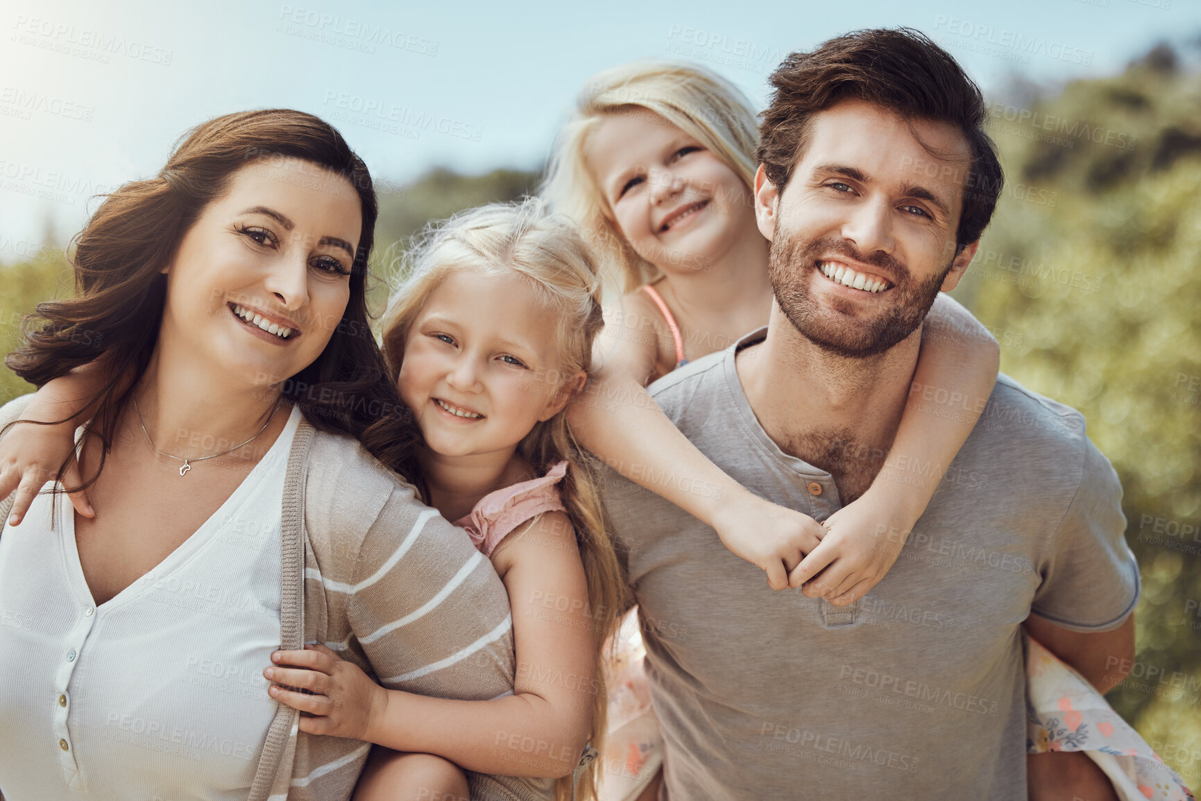 Buy stock photo Park, piggyback and portrait of parents with children enjoying quality time in nature, holiday and weekend. Family, love and happy kids, mom and dad smile for bonding, relax and adventure outdoors