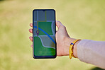 Woman, hand and phone for travel map, gps or sightseeing location research in nature park, forest or Canada woods. Zoom, tourist and mobile technology screen for direction, navigation or hiking route