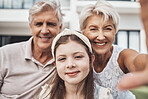Portrait, grandparents and child love taking a selfie as a happy family in summer holidays in a backyard. Elderly, relax or girl smiles in a picture while bonding with grandmother and old man at home