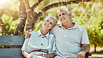Love, relax and old couple on bench in park with smile, embrace and bonding time in nature together. Romance, senior man and retired woman sitting in garden, happy people and romantic summer weekend.