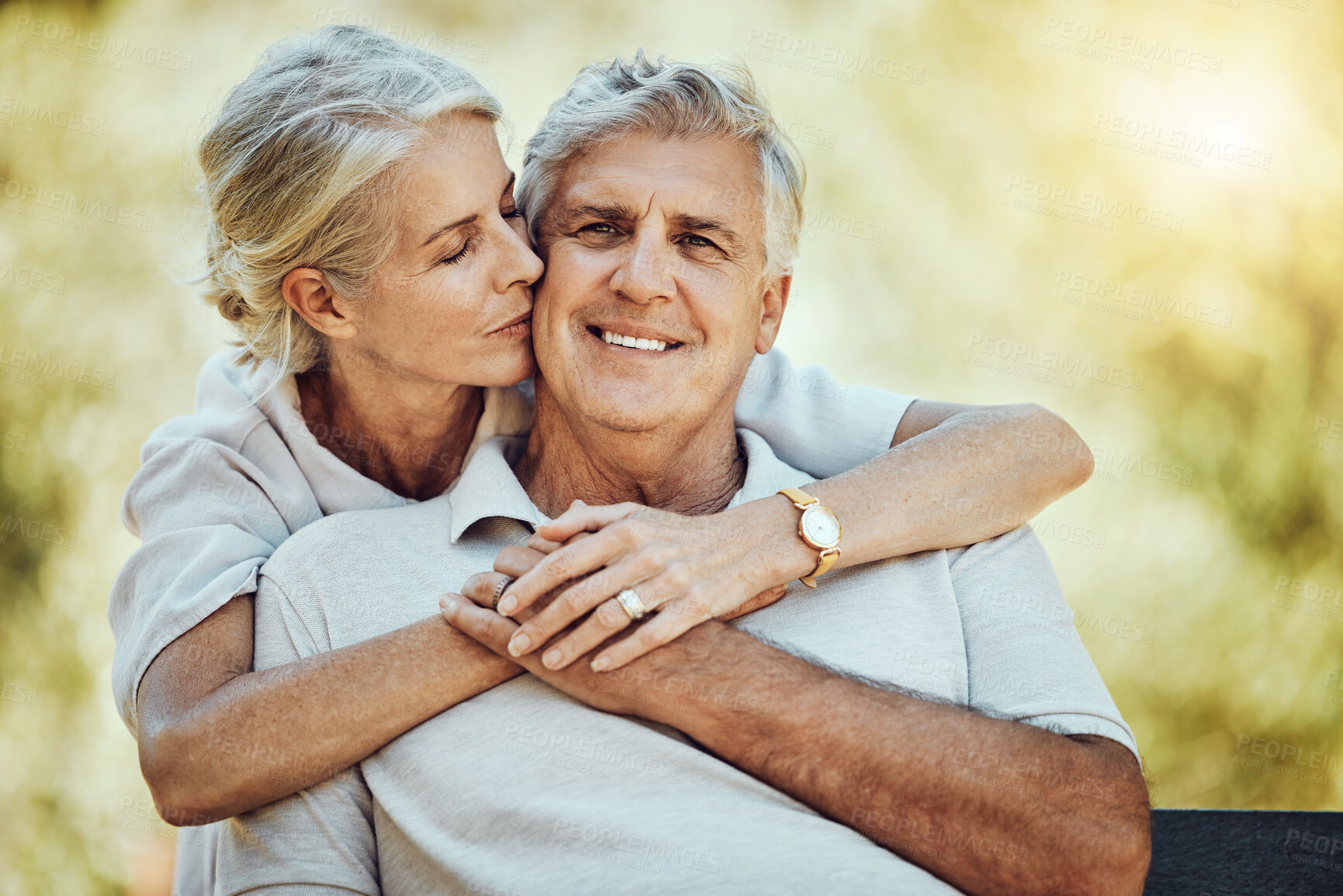 Buy stock photo Elderly, couple with hug in park and retirement with marriage, love and partnership, outdoor in nature. Portrait, kiss and old man with woman, care and trust, support and happy in relationship