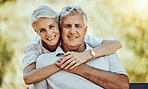 Old couple hug in park, love and marriage portrait, retirement together with commitment and outdoor. Mature man, elderly woman and care with trust and support, nature and happiness in relationship