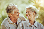 Love, hug or happy old couple in nature bonding or laughing in a marriage partnership in retirement. Peace, senior man or romantic elderly woman hugging together on a calm relaxing holiday vacation