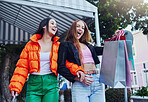 Shopping bag, excited and fashion people at outdoor market sale, discount or promotion of gen z, customer and retail. Happy women, friends and trendy youth for wealth, rich and urban street clothes