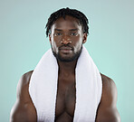 Black man, skincare and portrait of face with towel for beauty, hygiene and grooming in studio. Healthy person on blue background for facial glow, clean skin and self care with dermatology cosmetic 