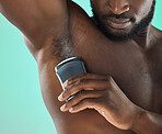 Armpit hygiene and black man with deodorant and self care routine product of people with body zoom in studio. Health, wellness and cosmetic grooming of young person at isolated green background



