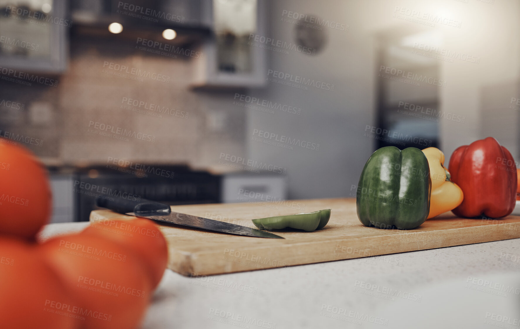 Buy stock photo Kitchen, table and cutting board with vegetables of colorful peppers for healthy meal preparation at home. Food, cooking or nutrition of organic grown consumables on counter for diet plan or vitamins