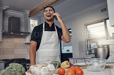 Buy stock photo Man, phone call and laughing or cooking in kitchen for healthy nutrition, food diet and organic vegetables salad. Young male, chef happiness and smile for smartphone call or cook dinner in home 