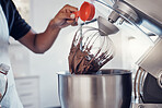 Baking, food and man with a machine for mixing, cooking and preparing a cake with ingredients. Snack, meal and hands of a baker making a dessert with an appliance in the kitchen for a career