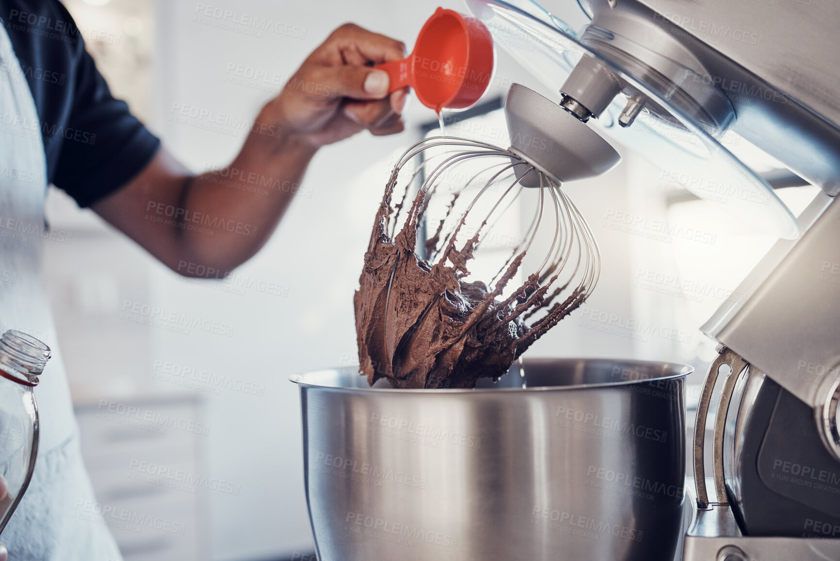 Buy stock photo Baking, food and man with a machine for mixing, cooking and preparing a cake with ingredients. Snack, meal and hands of a baker making a dessert with an appliance in the kitchen for a career