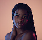 Portrait, hair and beauty with a model black woman in studio on a wall background for natural haircare. Face, makeup and braids with an attractive young female posing to promote keratin treatment