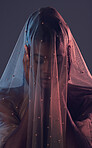 Fashion, veil and woman in studio for creative, textile and elegance against a dark background. Fabric, girl and model covered in material, vintage and retro style while standing, posing and isolated