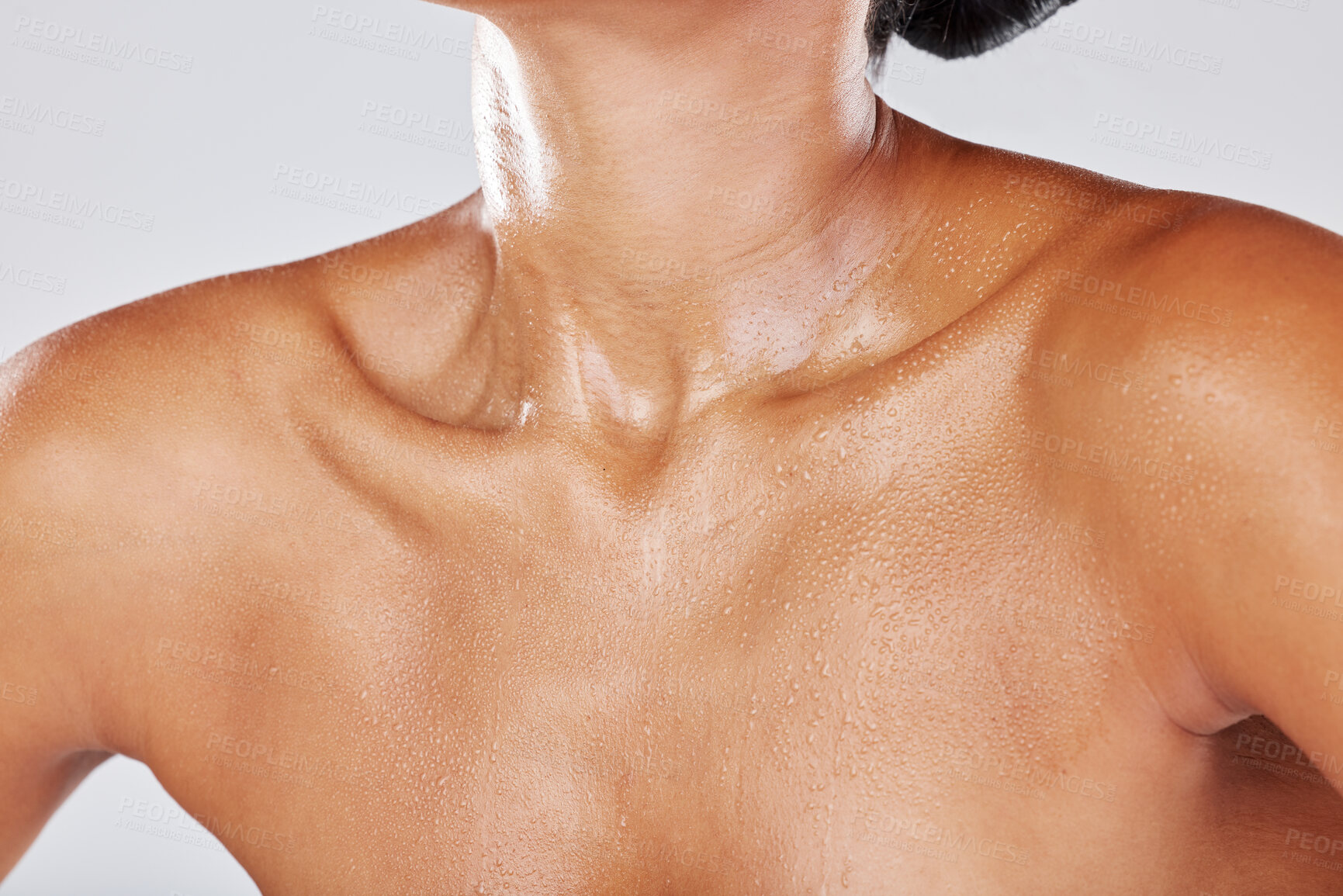 Buy stock photo Woman neck sweating due to exercise with wet skin as water drip on a female body isolated in studio white background. Shower, model and active person chest with liquid drops due to sports 