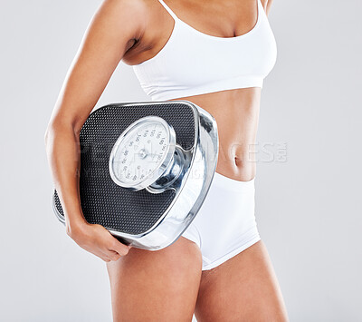 Buy stock photo Wellness, fitness and body of woman with scale in studio after workout, exercise and training to lose weight. Motivation, self care and female model for nutrition, diet routine and healthy lifestyle