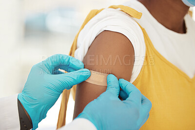Buy stock photo Covid, vaccine and bandaid on the arm of a black woman patient in a hospital for an injection or healthcare. Doctor, medical and insurance with a female in a clinc for her corona virus vaccination