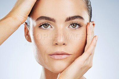 Buy stock photo Beauty, skincare and portrait of a woman with makeup isolated on a grey studio background. Glow, clean and face of a spa dermatology model with facial health, hydration and wellness on a backdrop