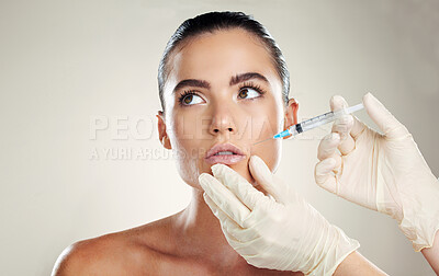 Buy stock photo Skincare, aesthetic beauty and woman with injection in lips from healthcare professional, anti aging treatment in studio. Collagen, mouth and model with facial lip filler syringe on white background.